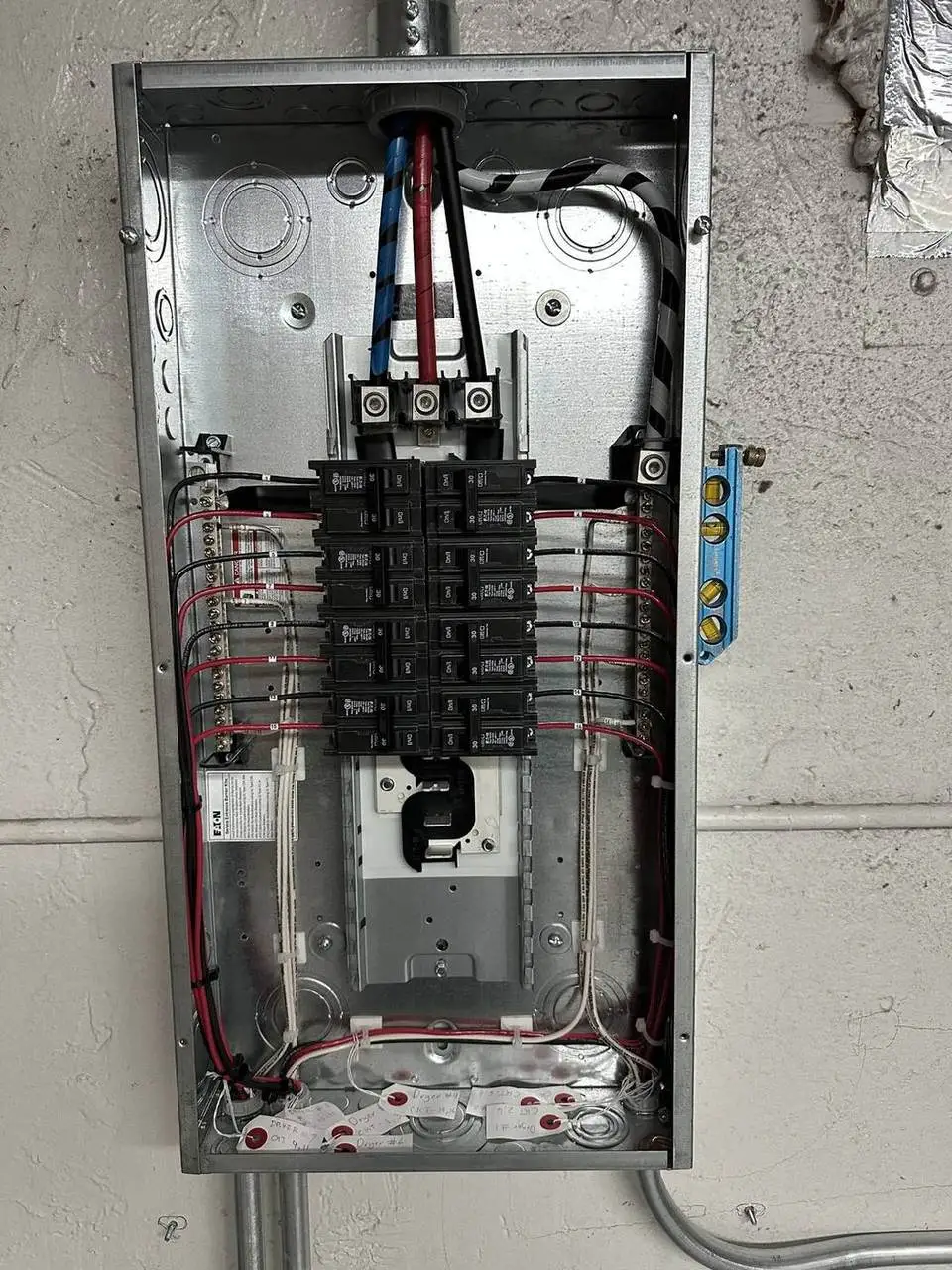 Eaton electrical panel with new breakers and neatly run circuits, wired by Electric A/C Inc in Queens