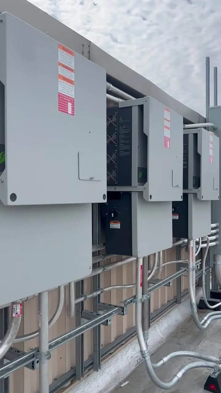 Solar inverters and disconnects wired by Electric A/C Inc on an NYC rooftop