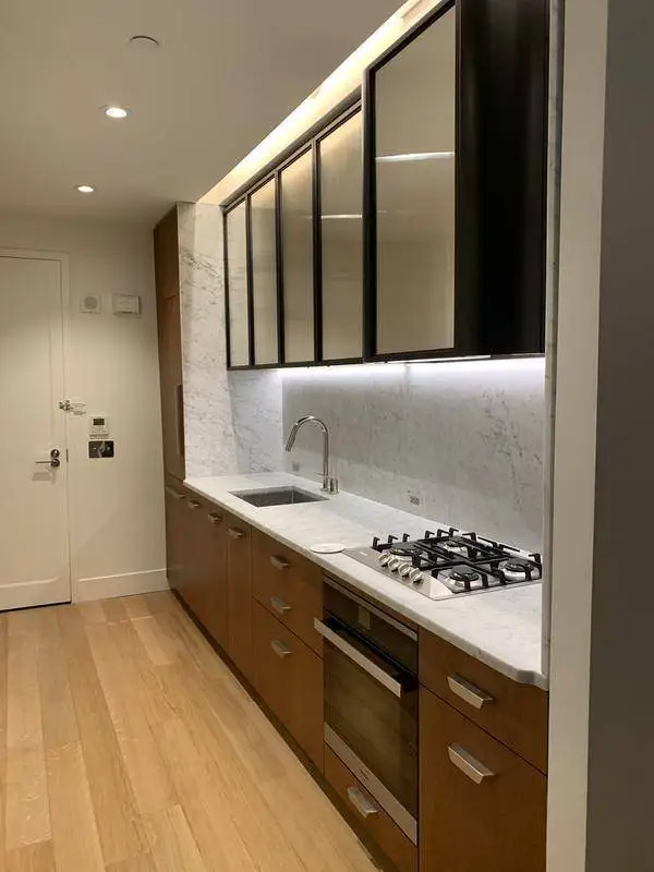 Kitchen with cove and under-cabinet lighting wired by Electric A/C Inc in a Queens home