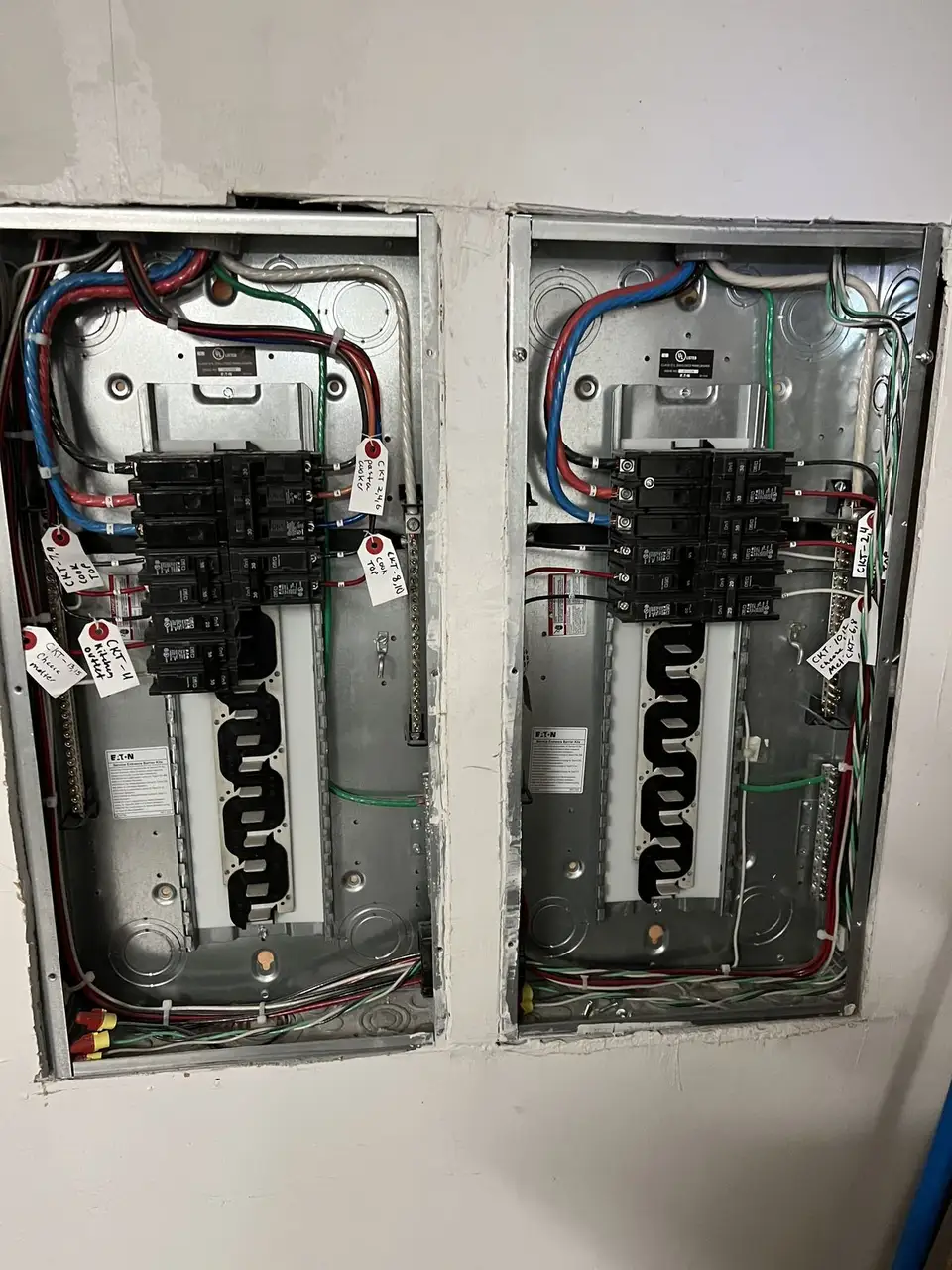 Two new electrical panels installed side by side by Electric A/C Inc in NYC