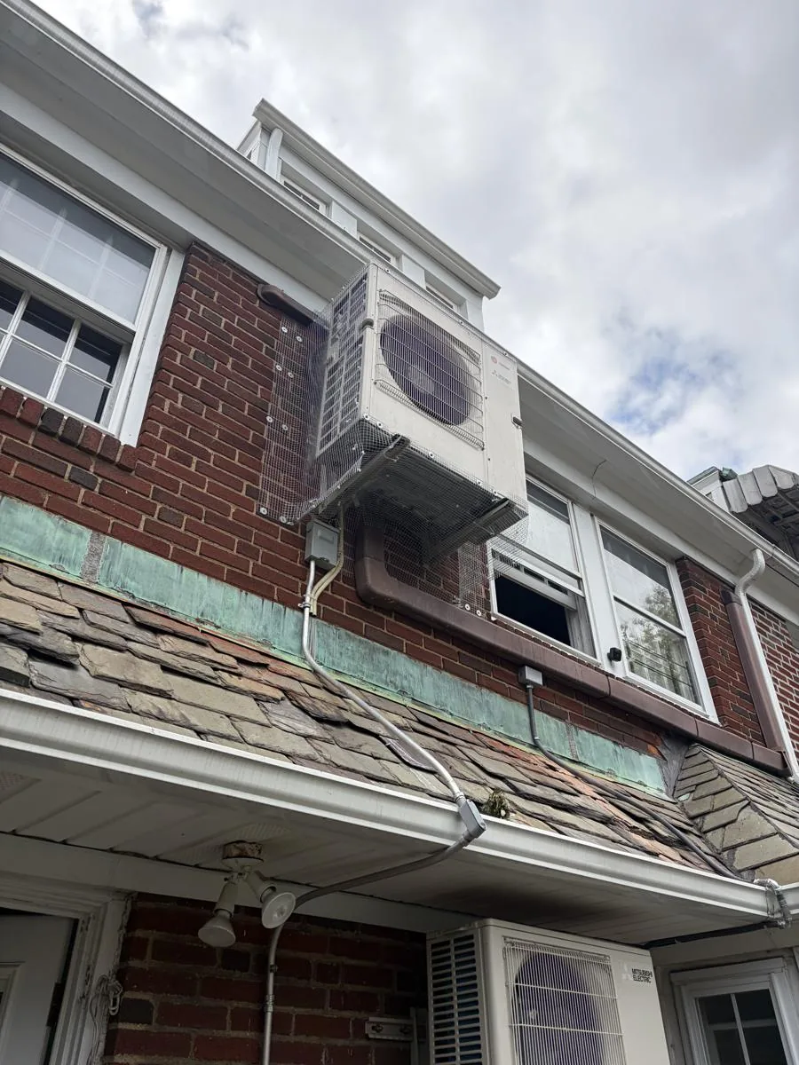Mini split condensers on a brick building in Jackson Heights, Queens